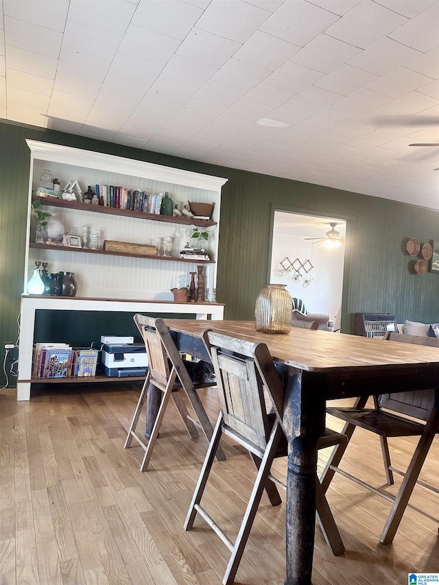 bar with light wood-type flooring