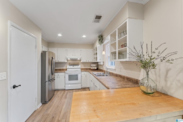 kitchen with white cabinetry, sink, stainless steel refrigerator, and electric stove