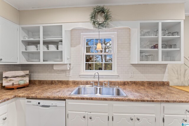 kitchen featuring white cabinetry, white dishwasher, sink, and decorative backsplash