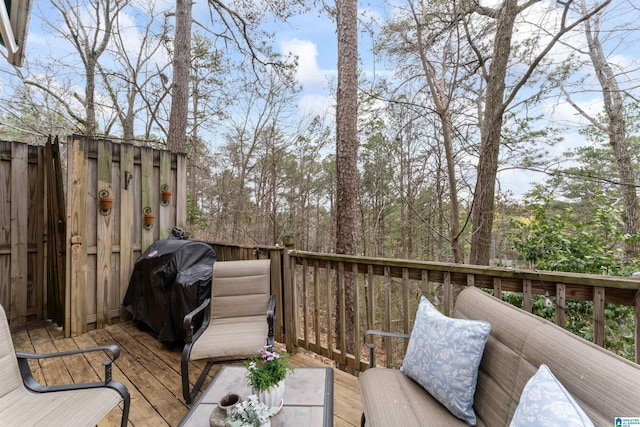 wooden terrace featuring a grill