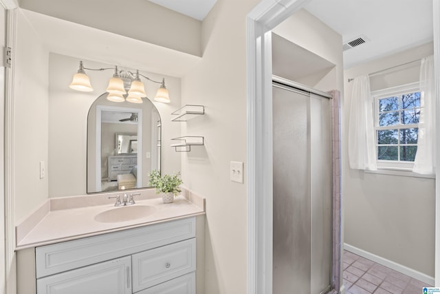 bathroom with vanity and a shower with shower door