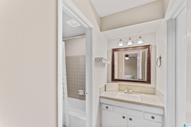 bathroom with vanity and shower / bath combination with curtain