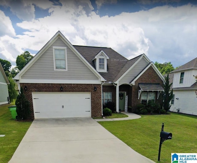 view of front of home featuring a garage and a front yard