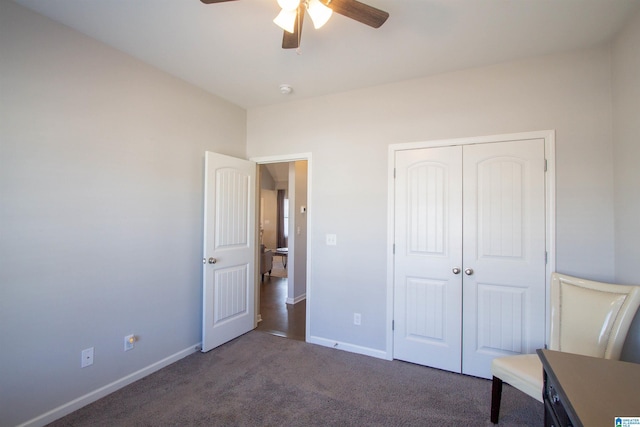 unfurnished bedroom featuring a closet, ceiling fan, and dark colored carpet