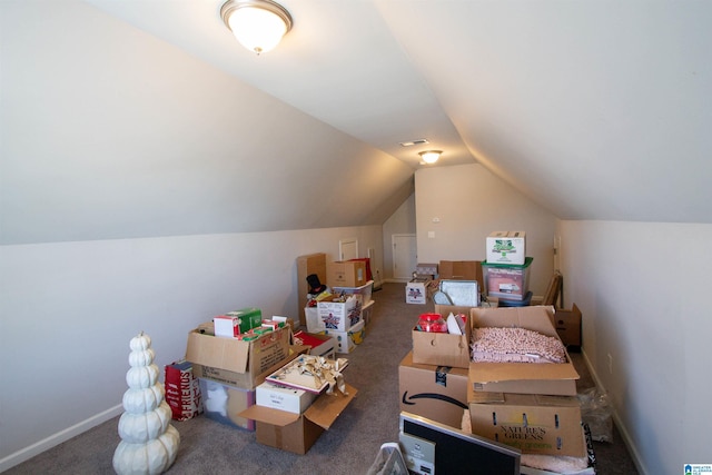 additional living space featuring lofted ceiling and carpet floors