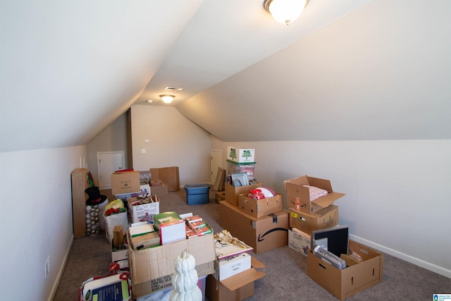 bonus room featuring carpet floors and vaulted ceiling