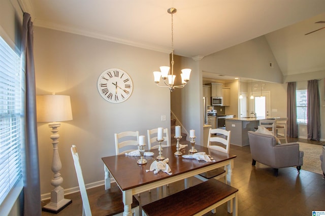 dining space featuring dark wood-type flooring, an inviting chandelier, sink, and vaulted ceiling