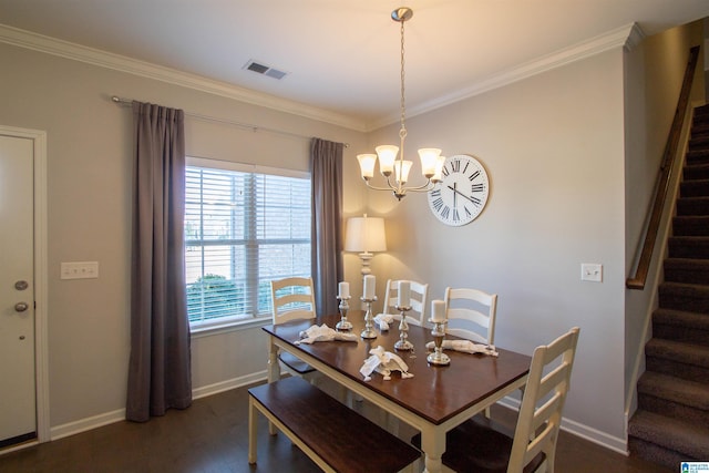 dining room featuring ornamental molding, dark wood-type flooring, and an inviting chandelier