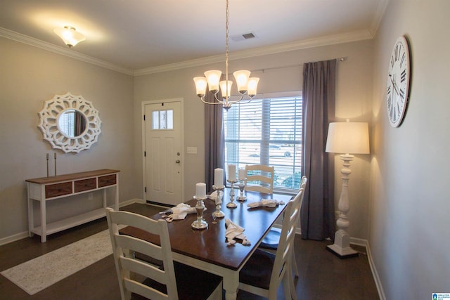 dining area featuring dark hardwood / wood-style flooring, ornamental molding, and a chandelier