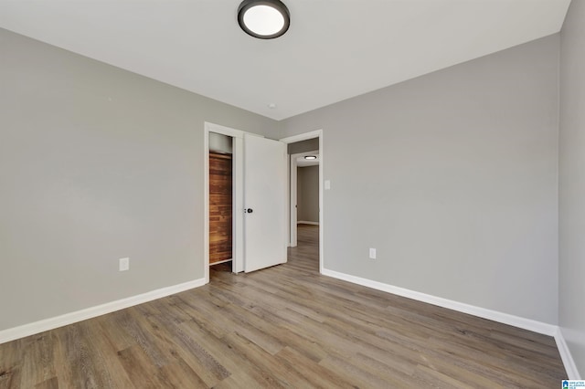 unfurnished bedroom with light wood-type flooring