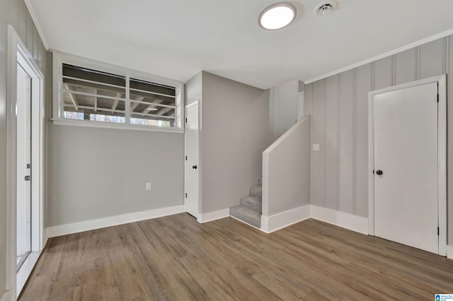 basement with hardwood / wood-style floors