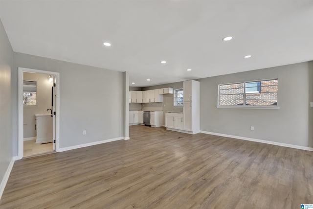 unfurnished living room with light wood-type flooring