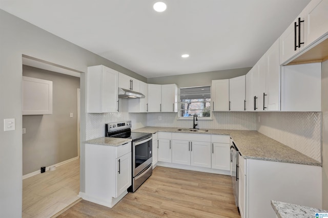 kitchen featuring appliances with stainless steel finishes, white cabinetry, sink, light stone countertops, and light hardwood / wood-style flooring