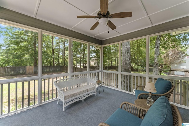 sunroom featuring ceiling fan