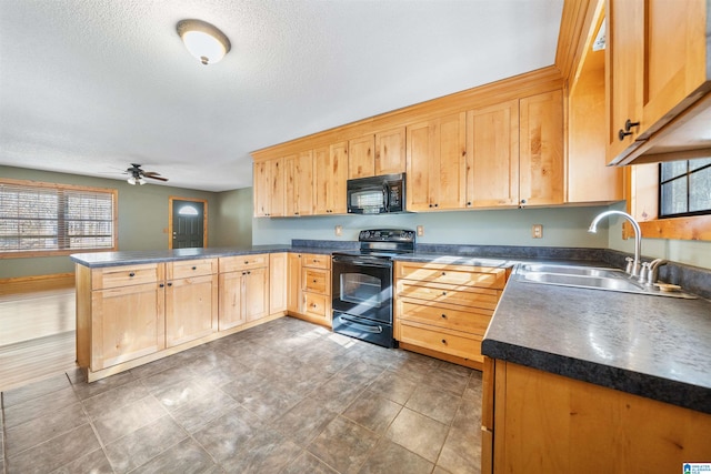 kitchen with kitchen peninsula, ceiling fan, sink, a textured ceiling, and black appliances