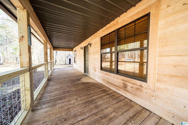 wooden terrace featuring covered porch