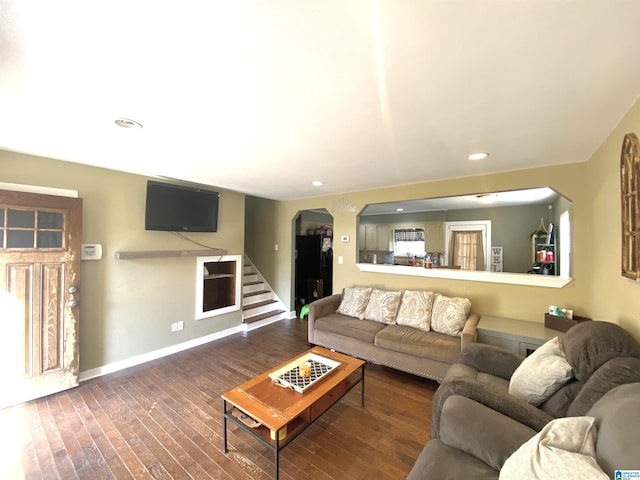 living room featuring dark wood-type flooring