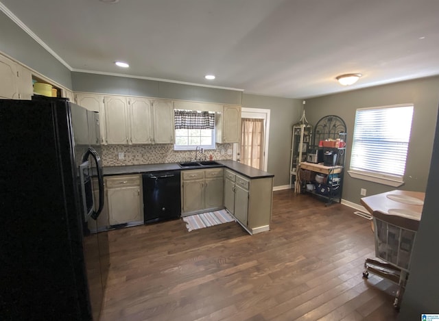 kitchen featuring black appliances, decorative backsplash, sink, dark hardwood / wood-style floors, and kitchen peninsula