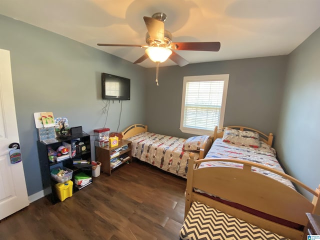 bedroom featuring ceiling fan and dark wood-type flooring