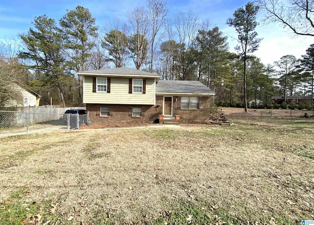 tri-level home with a front lawn