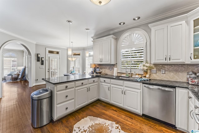 kitchen with white cabinets, dishwasher, and sink