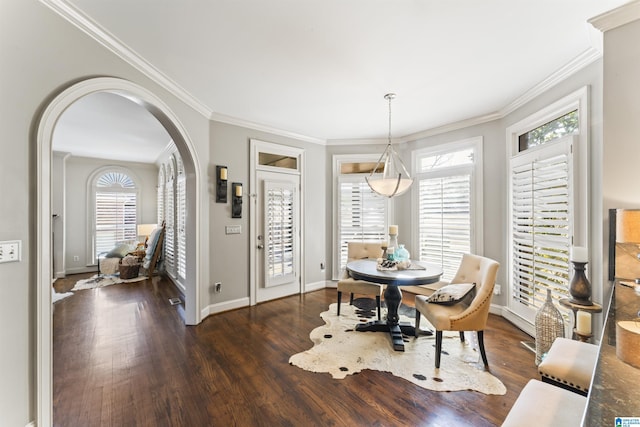 dining space featuring crown molding and dark hardwood / wood-style floors