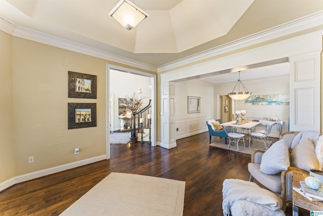 living room featuring a raised ceiling, crown molding, and dark hardwood / wood-style flooring