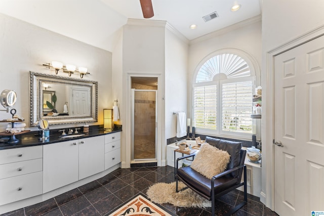 bathroom featuring crown molding, a shower with shower door, ceiling fan, and vanity