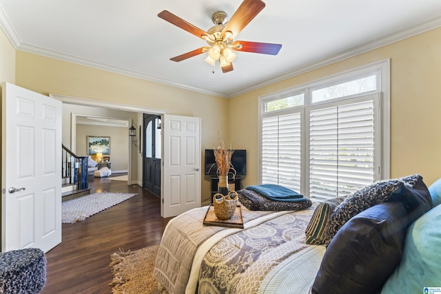 bedroom featuring crown molding, ceiling fan, and dark hardwood / wood-style flooring