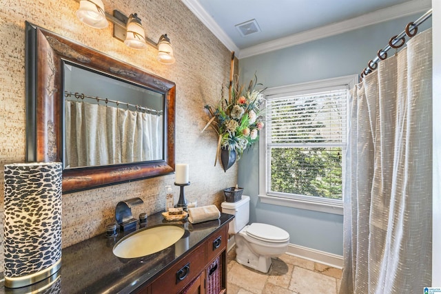 bathroom with toilet, vanity, a wealth of natural light, and ornamental molding