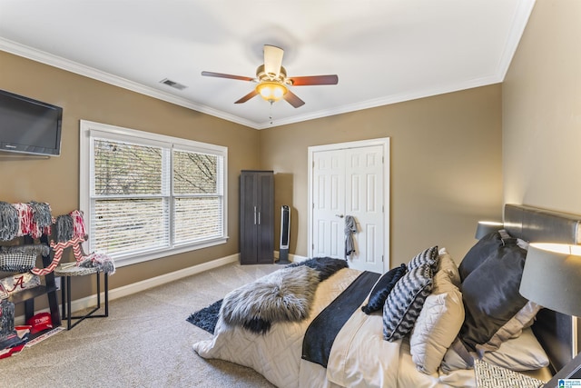 carpeted bedroom featuring crown molding and ceiling fan