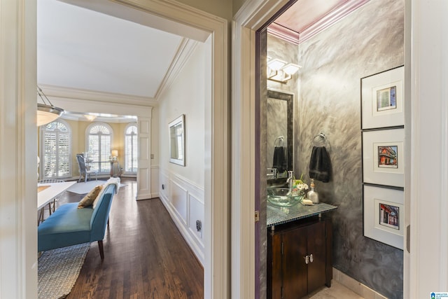 hall with crown molding and wood-type flooring