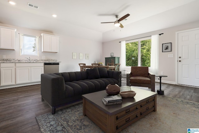 living room featuring ceiling fan, dark wood-type flooring, lofted ceiling, and sink