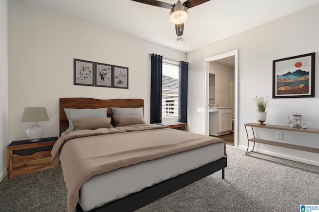 carpeted bedroom featuring ceiling fan and ensuite bathroom