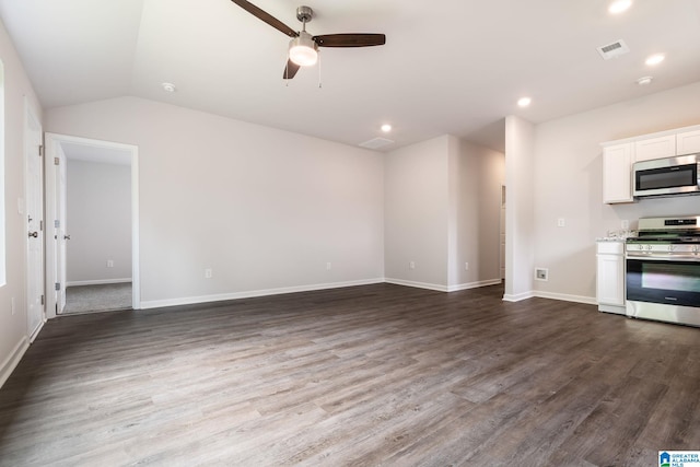 unfurnished living room featuring dark wood-type flooring, vaulted ceiling, and ceiling fan