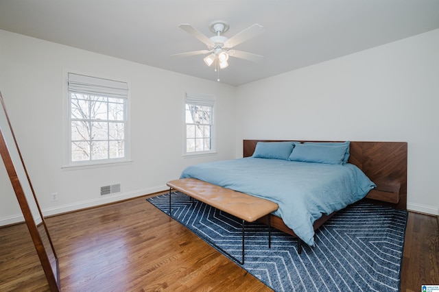 bedroom with wood-type flooring and ceiling fan