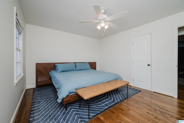 bedroom featuring hardwood / wood-style flooring and ceiling fan