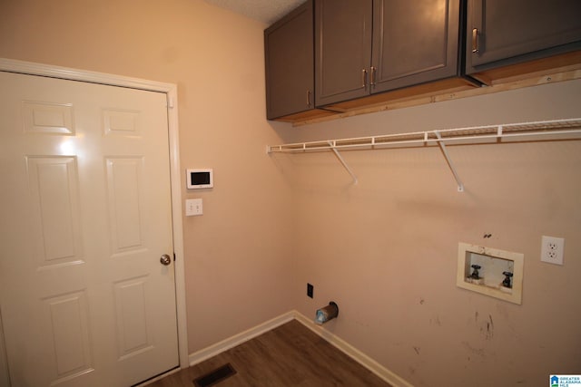 laundry room with cabinets, washer hookup, and dark hardwood / wood-style floors