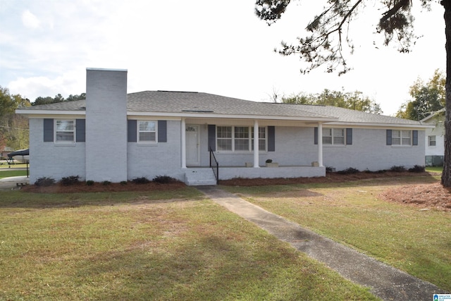 ranch-style home featuring a front yard