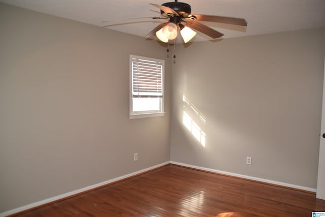 empty room with ceiling fan and wood-type flooring