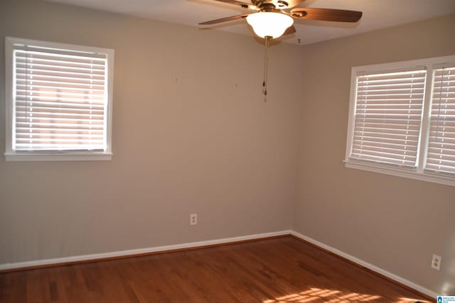 unfurnished room with hardwood / wood-style flooring and ceiling fan