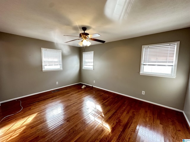 unfurnished room featuring hardwood / wood-style flooring and ceiling fan