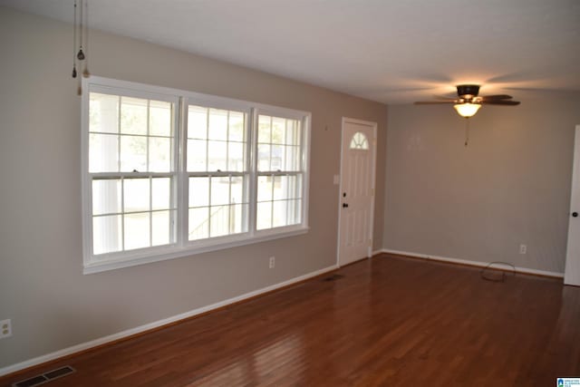 interior space featuring ceiling fan and dark wood-type flooring