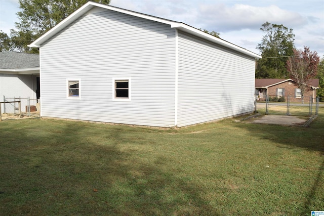 view of home's exterior with a lawn