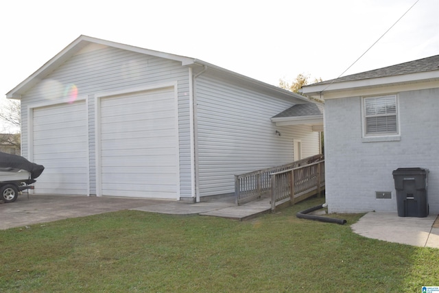 view of home's exterior with a wooden deck, a yard, and a garage