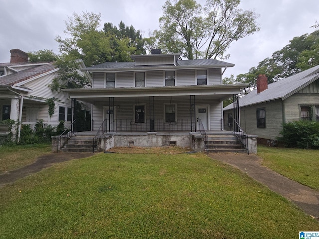 view of front of house with covered porch and a front yard