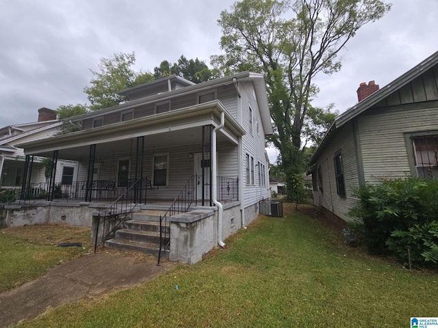 bungalow-style home featuring a porch and a front yard