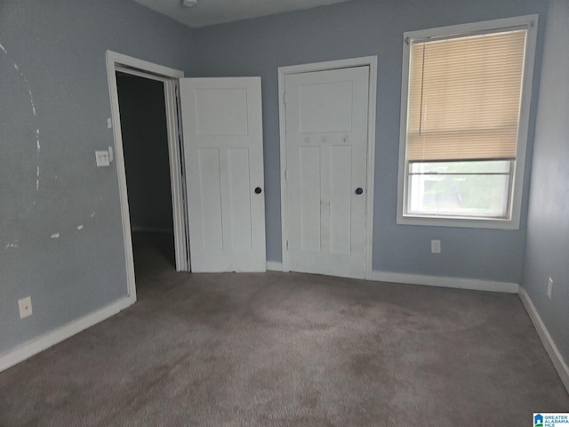 unfurnished bedroom with carpet flooring