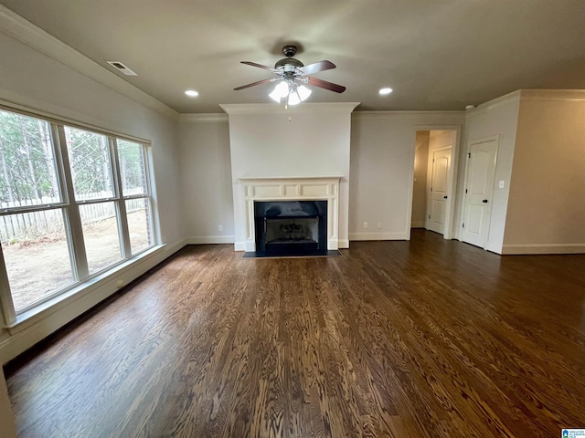 unfurnished living room with dark hardwood / wood-style flooring, ornamental molding, and a high end fireplace