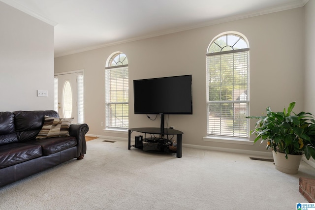 living room with ornamental molding and light carpet